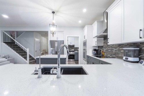1153 Chinook Gate Bay Sw, Airdrie, AB - Indoor Photo Showing Kitchen With Double Sink With Upgraded Kitchen