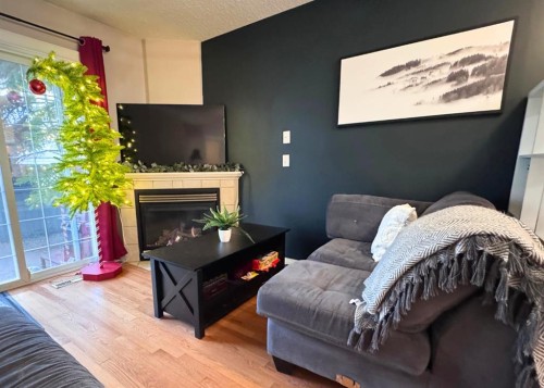 411-103 Strathaven Drive, Strathmore, AB - Indoor Photo Showing Living Room With Fireplace