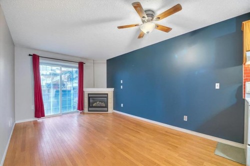 411-103 Strathaven Drive, Strathmore, AB - Indoor Photo Showing Living Room With Fireplace