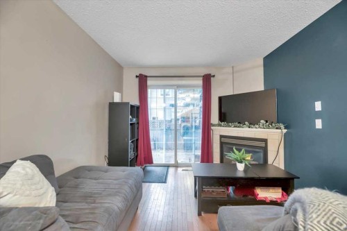 411-103 Strathaven Drive, Strathmore, AB - Indoor Photo Showing Living Room With Fireplace