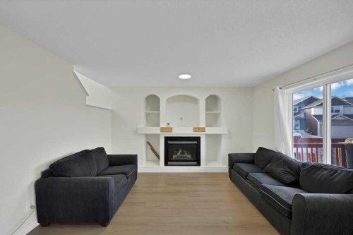 5934 Saddlehorn Drive Ne, Calgary, AB - Indoor Photo Showing Living Room With Fireplace