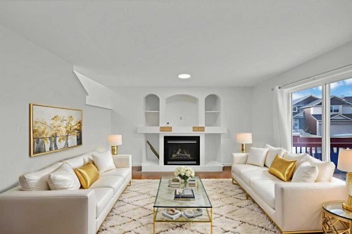 5934 Saddlehorn Drive Ne, Calgary, AB - Indoor Photo Showing Living Room With Fireplace
