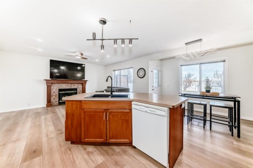 214 Coville Circle Ne, Calgary, AB - Indoor Photo Showing Kitchen With Fireplace