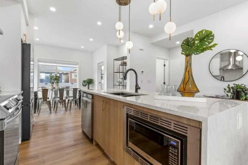 409-200 Belvedere Boulevard Se, Calgary, AB - Indoor Photo Showing Kitchen With Double Sink With Upgraded Kitchen