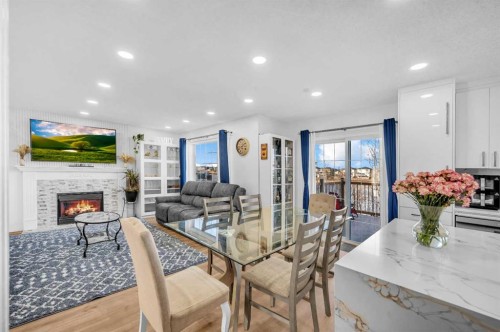 300 Taracove Estate Drive Ne, Calgary, AB - Indoor With Fireplace