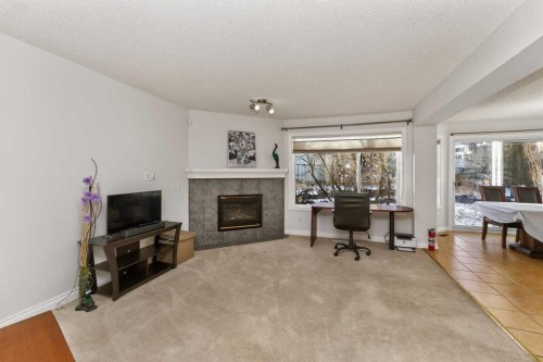 263 Citadel Meadow Grove Nw, Calgary, AB - Indoor Photo Showing Living Room With Fireplace