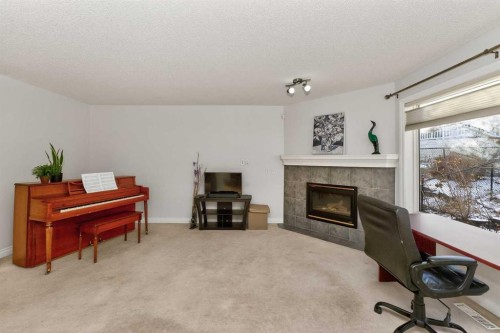 263 Citadel Meadow Grove Nw, Calgary, AB - Indoor Photo Showing Living Room With Fireplace