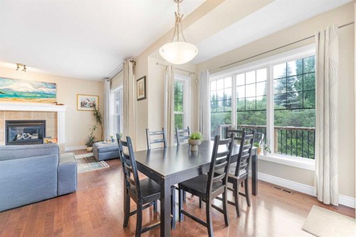 10 Tusslewood Heights Nw, Calgary, AB - Indoor Photo Showing Dining Room With Fireplace