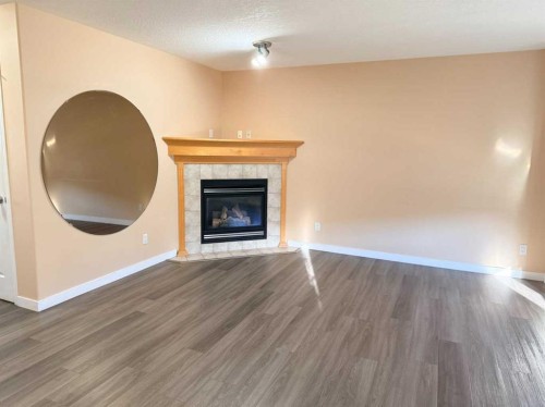 672 Taradale Drive Ne, Calgary, AB - Indoor With Fireplace