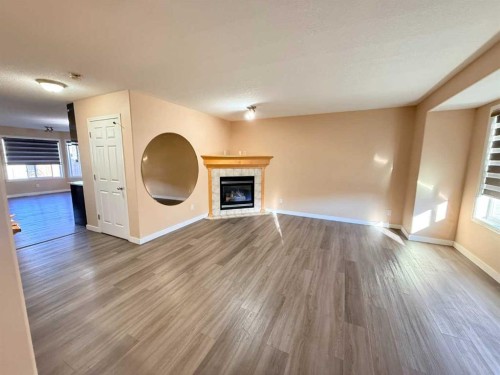 672 Taradale Drive Ne, Calgary, AB - Indoor With Fireplace