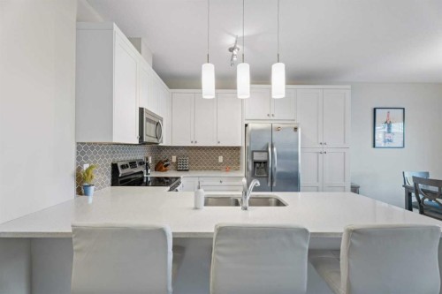 1191 Channelside Drive Sw, Airdrie, AB - Indoor Photo Showing Kitchen With Double Sink With Upgraded Kitchen