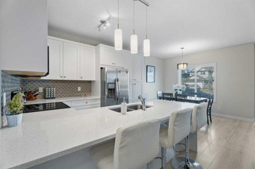 1191 Channelside Drive Sw, Airdrie, AB - Indoor Photo Showing Kitchen With Double Sink With Upgraded Kitchen