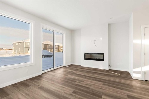 62 Setonvista Grove Se, Calgary, AB - Indoor Photo Showing Living Room With Fireplace