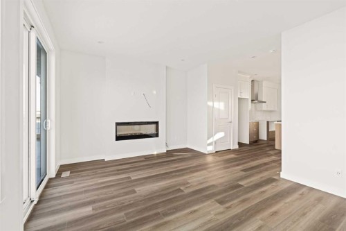 62 Setonvista Grove Se, Calgary, AB - Indoor Photo Showing Living Room With Fireplace
