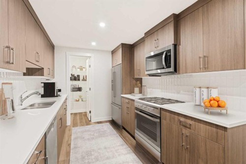 62 Setonvista Grove Se, Calgary, AB - Indoor Photo Showing Kitchen With Double Sink