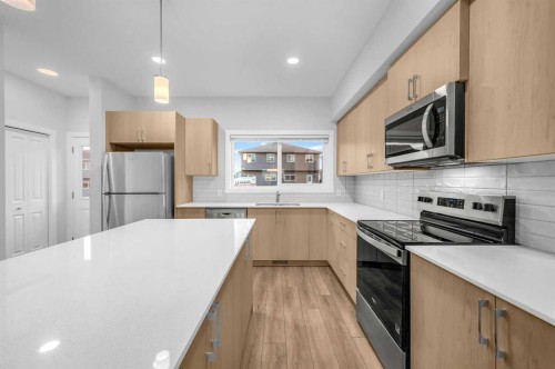 164 Legacy Reach Close Se, Calgary, AB - Indoor Photo Showing Kitchen With Stainless Steel Kitchen With Upgraded Kitchen