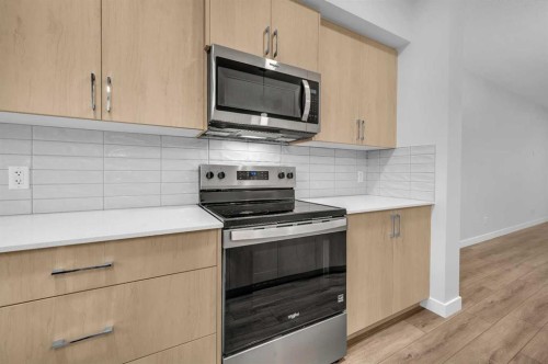 164 Legacy Reach Close Se, Calgary, AB - Indoor Photo Showing Kitchen With Upgraded Kitchen