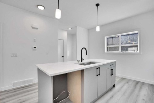 59 Baysprings Terrace Sw, Airdrie, AB - Indoor Photo Showing Kitchen With Double Sink