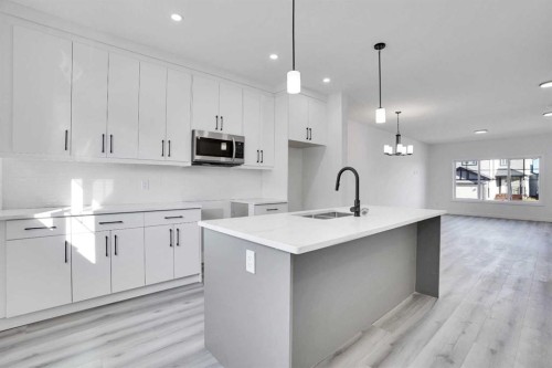 59 Baysprings Terrace Sw, Airdrie, AB - Indoor Photo Showing Kitchen With Upgraded Kitchen