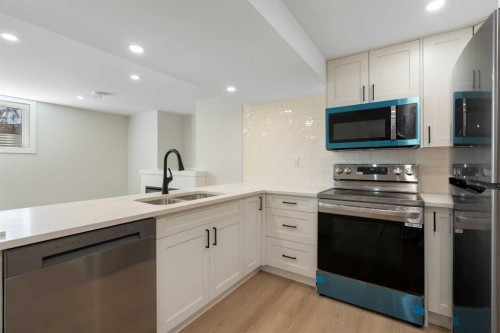 924 Canna Crescent Sw, Calgary, AB - Indoor Photo Showing Kitchen With Double Sink