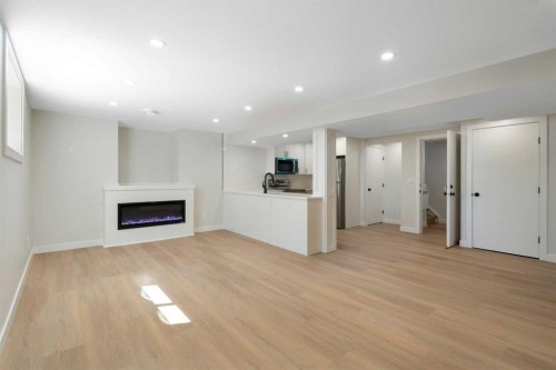 924 Canna Crescent Sw, Calgary, AB - Indoor Photo Showing Living Room With Fireplace