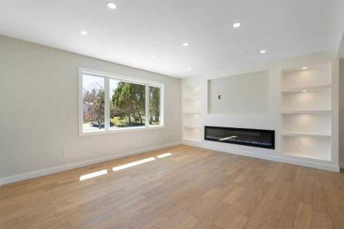 924 Canna Crescent Sw, Calgary, AB - Indoor Photo Showing Living Room With Fireplace
