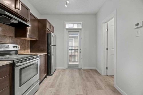 39 New Brighton Point Se, Calgary, AB - Indoor Photo Showing Kitchen