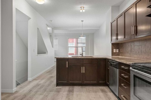 39 New Brighton Point Se, Calgary, AB - Indoor Photo Showing Kitchen