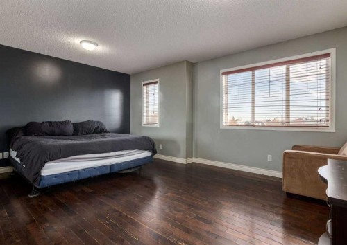 37 Cimarron Meadows Bay, Okotoks, AB - Indoor Photo Showing Bedroom