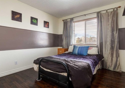 37 Cimarron Meadows Bay, Okotoks, AB - Indoor Photo Showing Bedroom