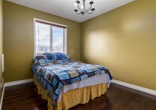37 Cimarron Meadows Bay, Okotoks, AB - Indoor Photo Showing Bedroom