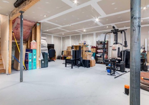 37 Cimarron Meadows Bay, Okotoks, AB - Indoor Photo Showing Gym Room