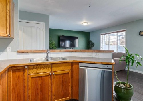 37 Cimarron Meadows Bay, Okotoks, AB - Indoor Photo Showing Kitchen With Double Sink