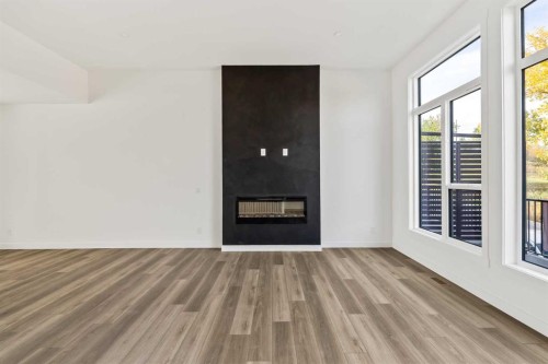2507 Sovereign Crescent Sw, Calgary, AB - Indoor Photo Showing Living Room With Fireplace