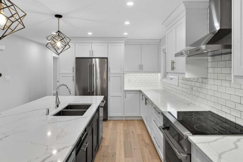 3704 58 Avenue Sw, Calgary, AB - Indoor Photo Showing Kitchen With Stainless Steel Kitchen With Double Sink With Upgraded Kitchen