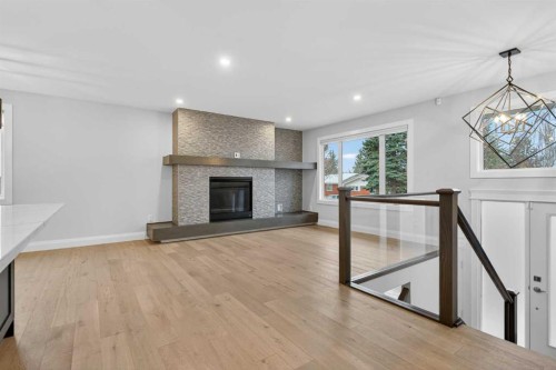 3704 58 Avenue Sw, Calgary, AB - Indoor Photo Showing Living Room With Fireplace