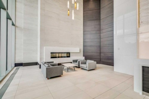 801-930 16 Avenue Sw, Calgary, AB - Indoor Photo Showing Other Room With Fireplace