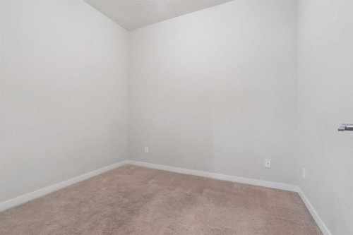 9314-101 Sunset Drive, Cochrane, AB - Indoor Photo Showing Other Room