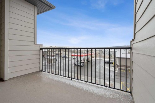 9314-101 Sunset Drive, Cochrane, AB - Outdoor With Balcony With Exterior