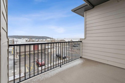 9314-101 Sunset Drive, Cochrane, AB - Outdoor With Balcony With Exterior