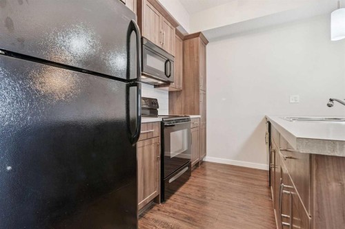 9314-101 Sunset Drive, Cochrane, AB - Indoor Photo Showing Kitchen