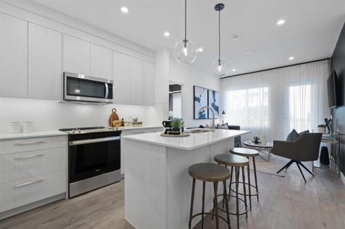 3314-6 Merganser Drive West, Chestermere, AB - Indoor Photo Showing Kitchen With Upgraded Kitchen