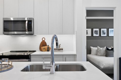 3314-6 Merganser Drive West, Chestermere, AB - Indoor Photo Showing Kitchen With Double Sink