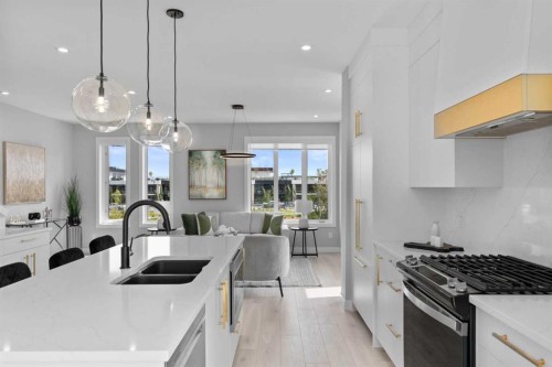 501-8155 8 Avenue Sw, Calgary, AB - Indoor Photo Showing Kitchen With Double Sink With Upgraded Kitchen