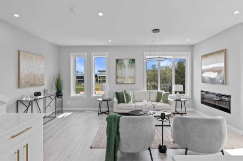 501-8155 8 Avenue Sw, Calgary, AB - Indoor Photo Showing Living Room With Fireplace