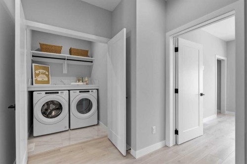 501-8155 8 Avenue Sw, Calgary, AB - Indoor Photo Showing Laundry Room
