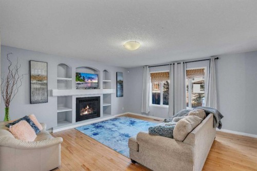 6 Morningside Landing Sw, Airdrie, AB - Indoor Photo Showing Living Room With Fireplace