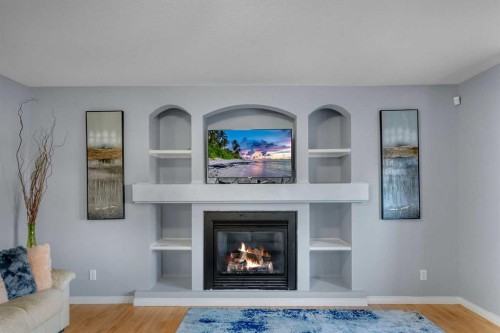 6 Morningside Landing Sw, Airdrie, AB - Indoor Photo Showing Living Room With Fireplace