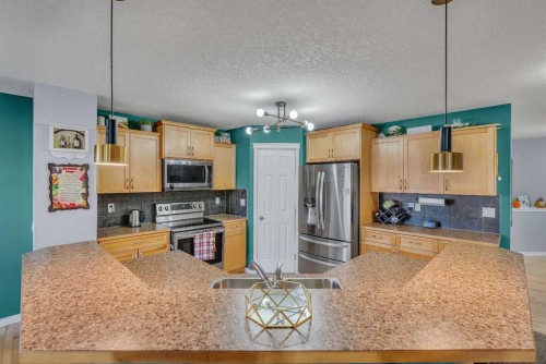 6 Morningside Landing Sw, Airdrie, AB - Indoor Photo Showing Kitchen With Stainless Steel Kitchen With Double Sink