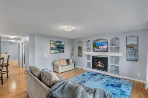 6 Morningside Landing Sw, Airdrie, AB - Indoor Photo Showing Living Room With Fireplace